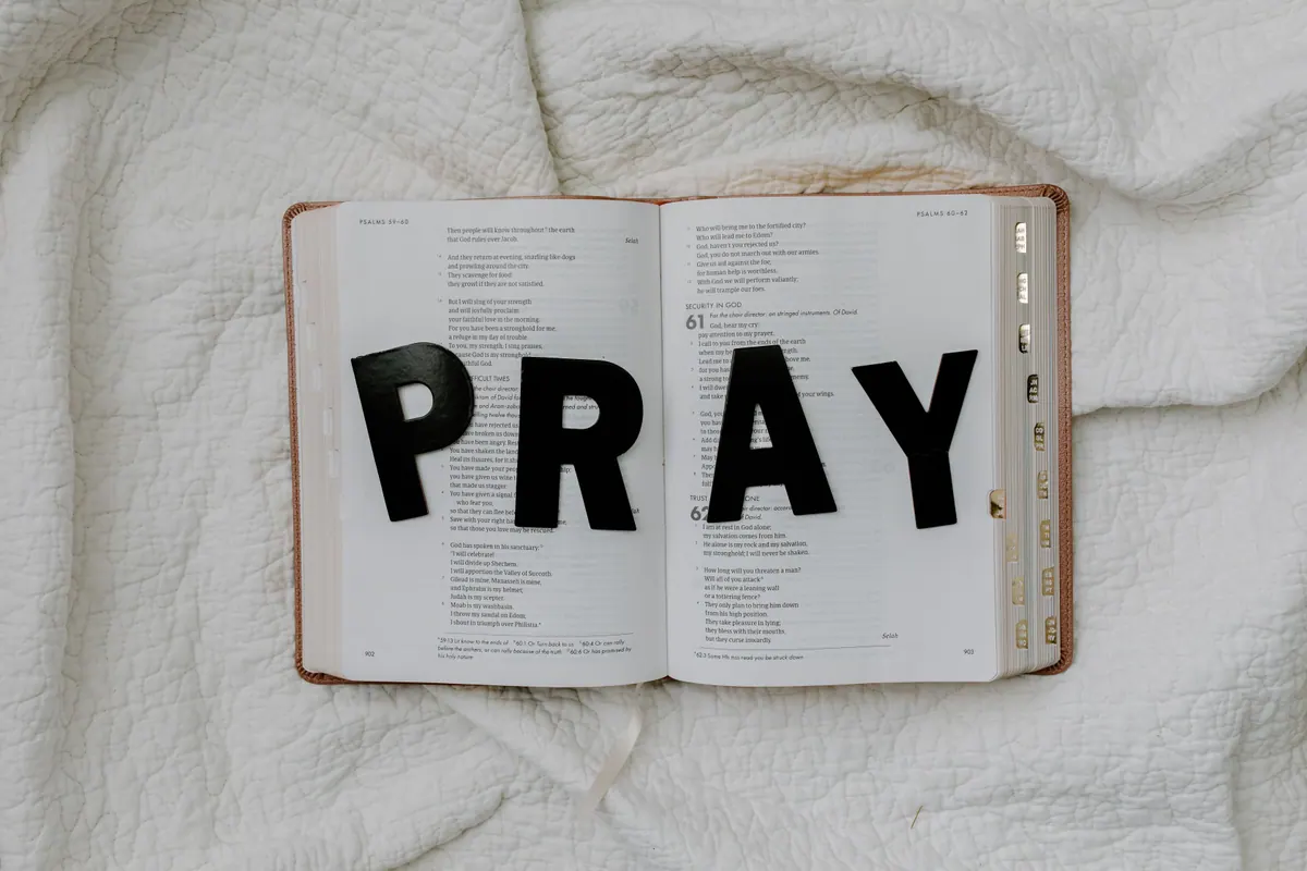 Open Bible with prayer reminder for healing and hope