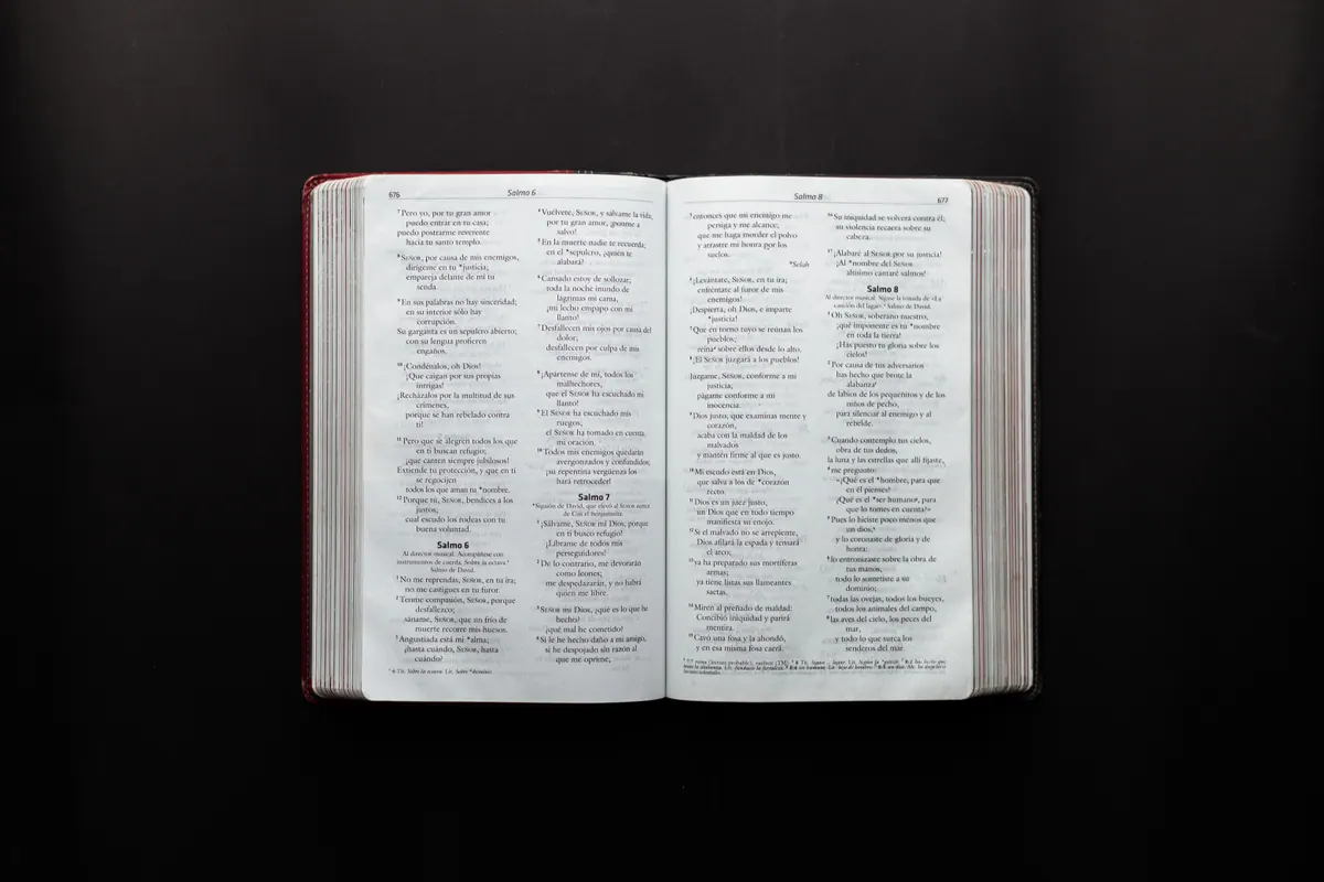 Open Bible displaying Psalms on a dark background