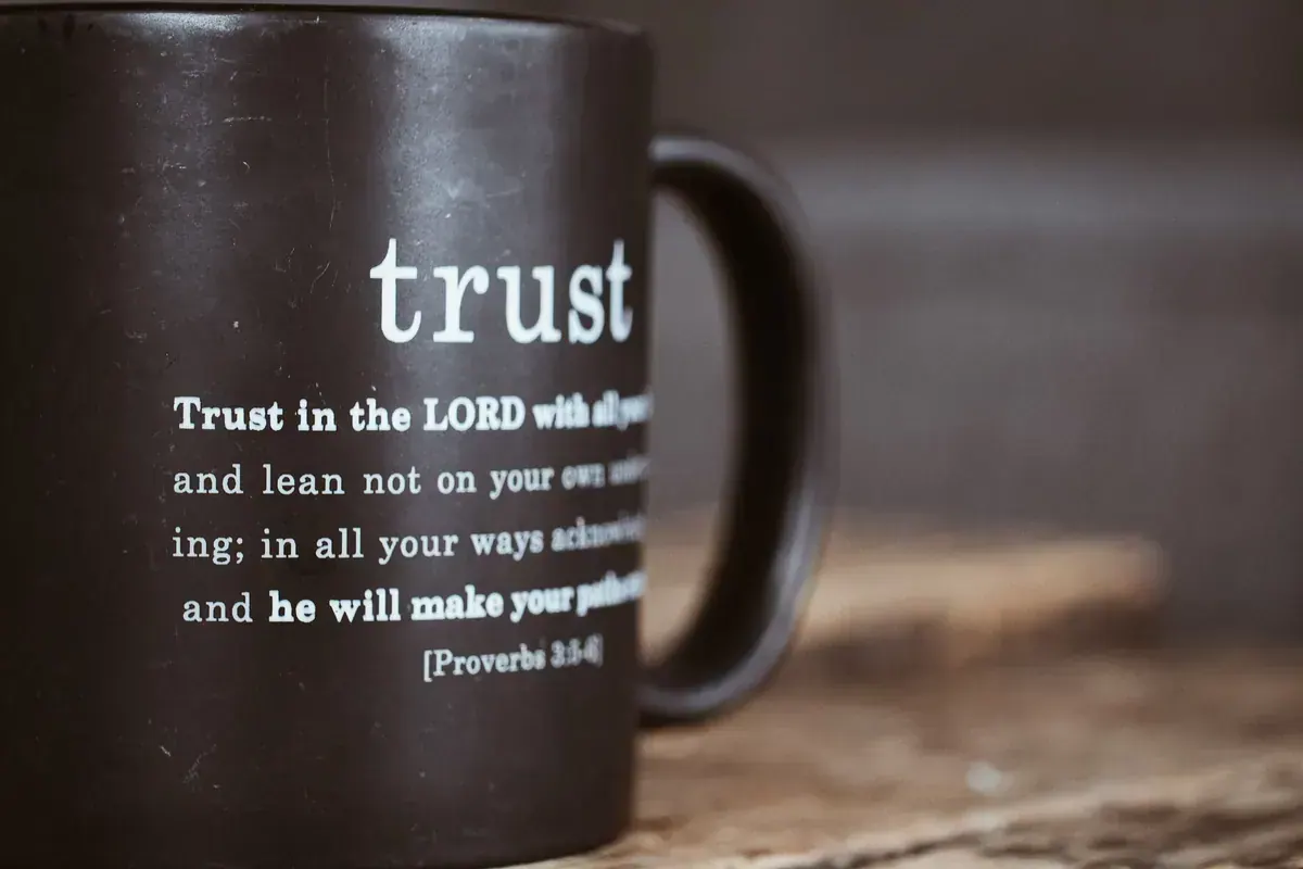 Hands lifted in prayer while trusting God for healing
