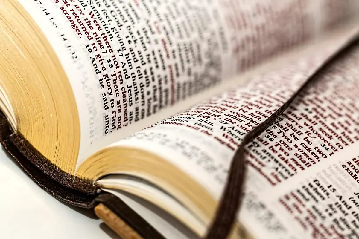 Open book and quiet prayerful reflection during scripture meditation