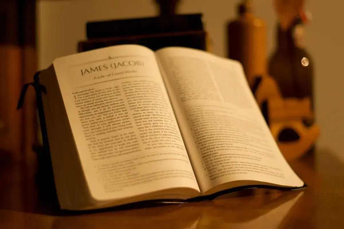 Open Bible on a wooden table representing meditation on healing scriptures